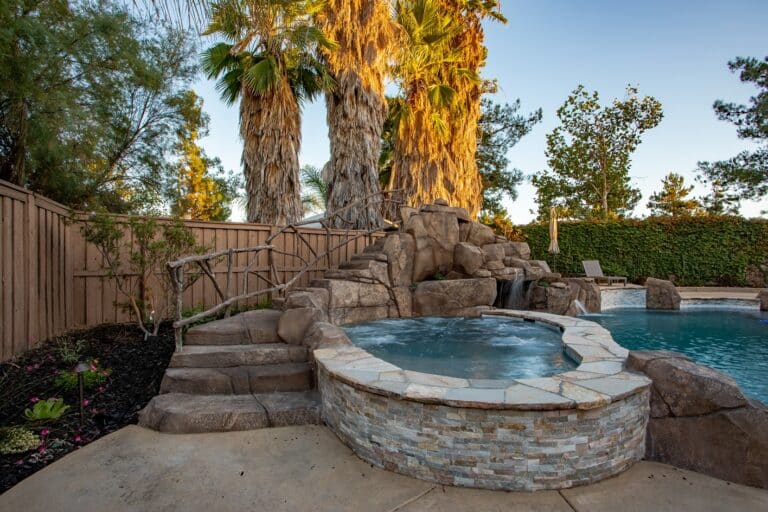 Custom backyard pool with hot tub