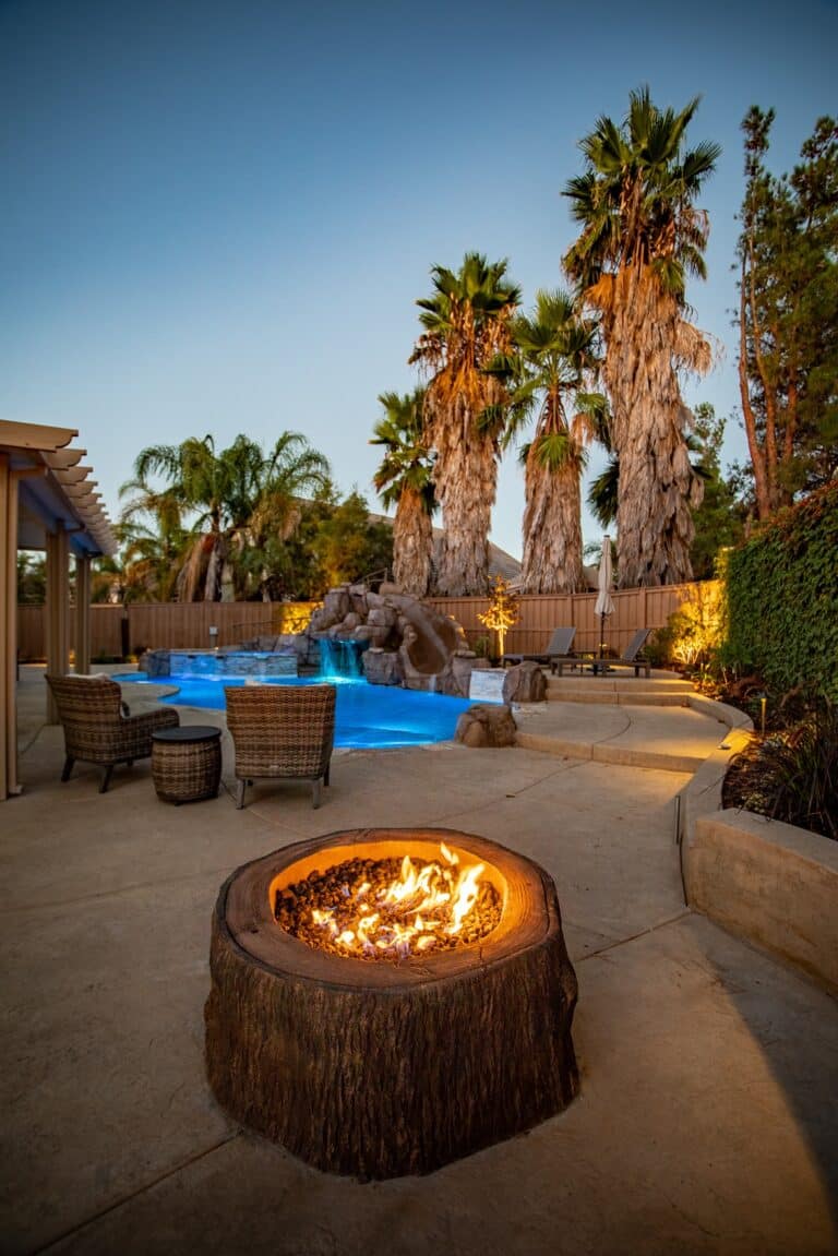 Custom backyard pool with fire pit
