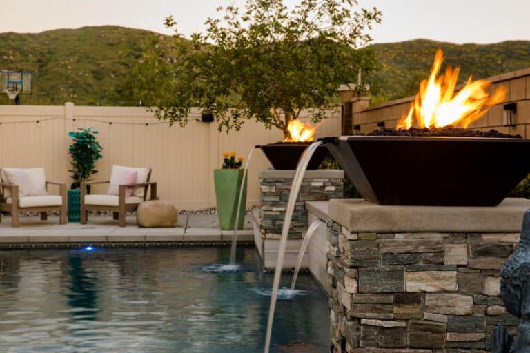 Custom backyard pool with fire pits